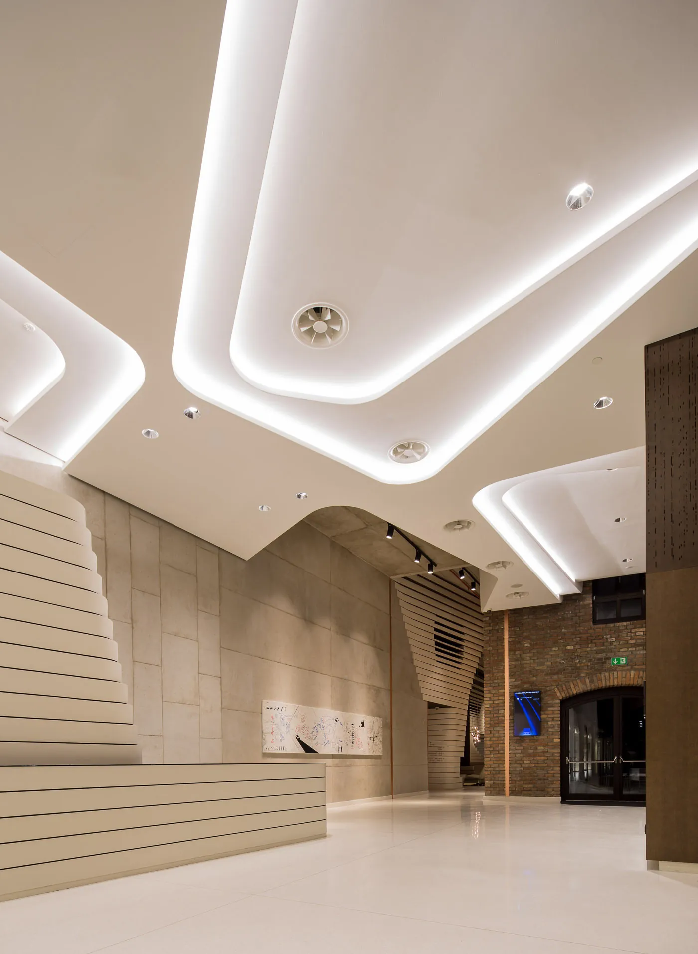 Office atrium with downlights and cove lighting